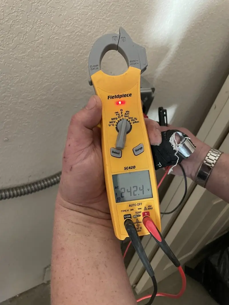 Voltage testing with clamp meter during Whole House Surge Protector in Peachtree City